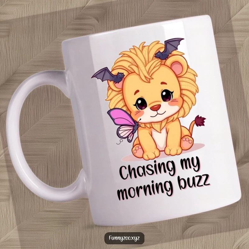 Funny mug showing a playful lion cub with a fluffy yarn mane innocently batting at a butterfly.