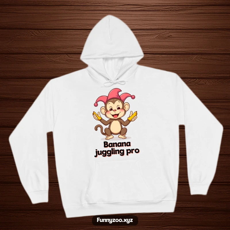 Funny Monkey Juggling Bananas Hoodie: A comical jester monkey is depicted mid-juggle with colorful bananas, perfect for cozy, humorous wear.