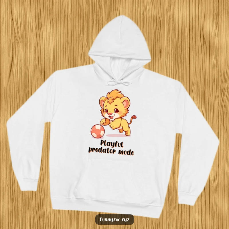Funny Lion Cub Pounce Hoodie: Comfortable hoodie featuring a cute lion cub playfully pouncing on a bouncy ball.