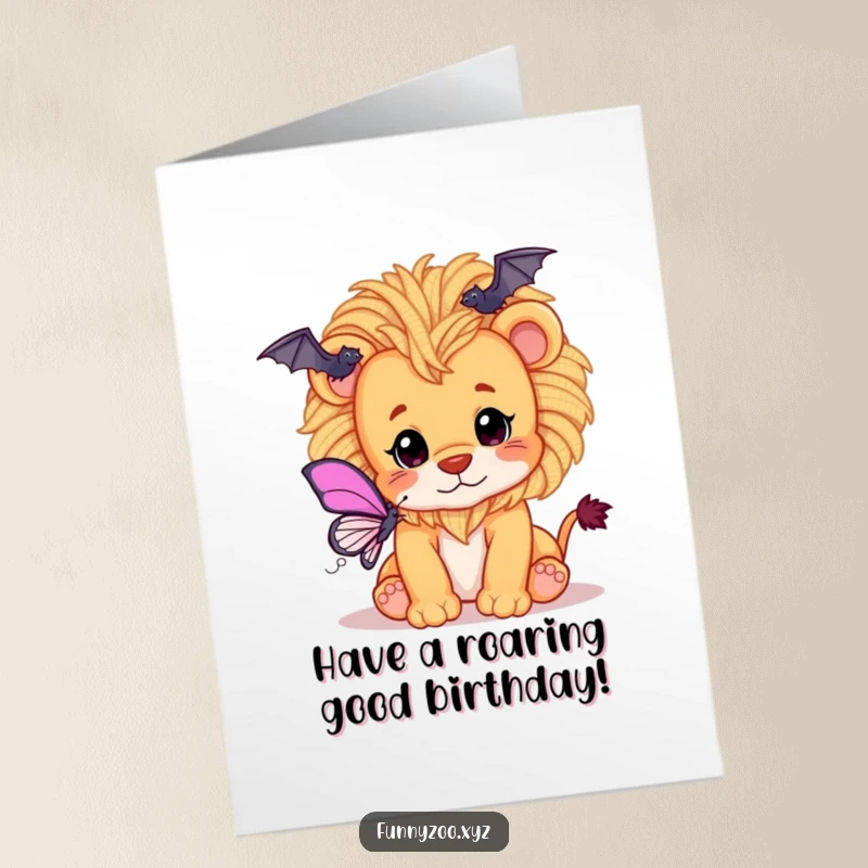 Funny Free Printable Birthday Card: Playful lion cub with a mane made of fluffy yarn batting at a colorful butterfly.