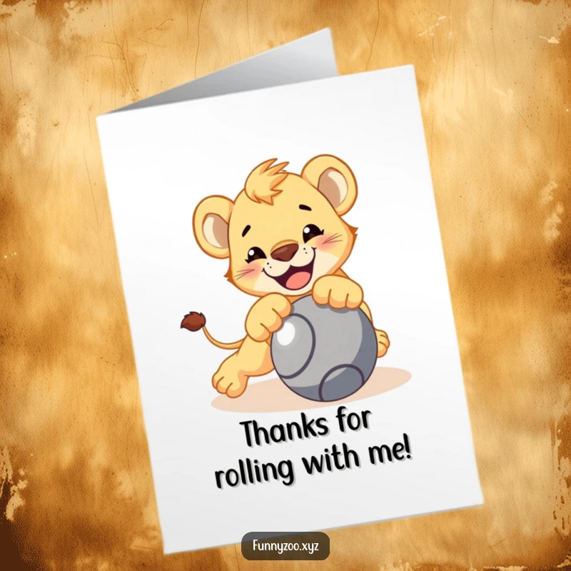 Funny Free Printable thank you card of a smiling lion cub playfully pouncing towards a rolling ball.